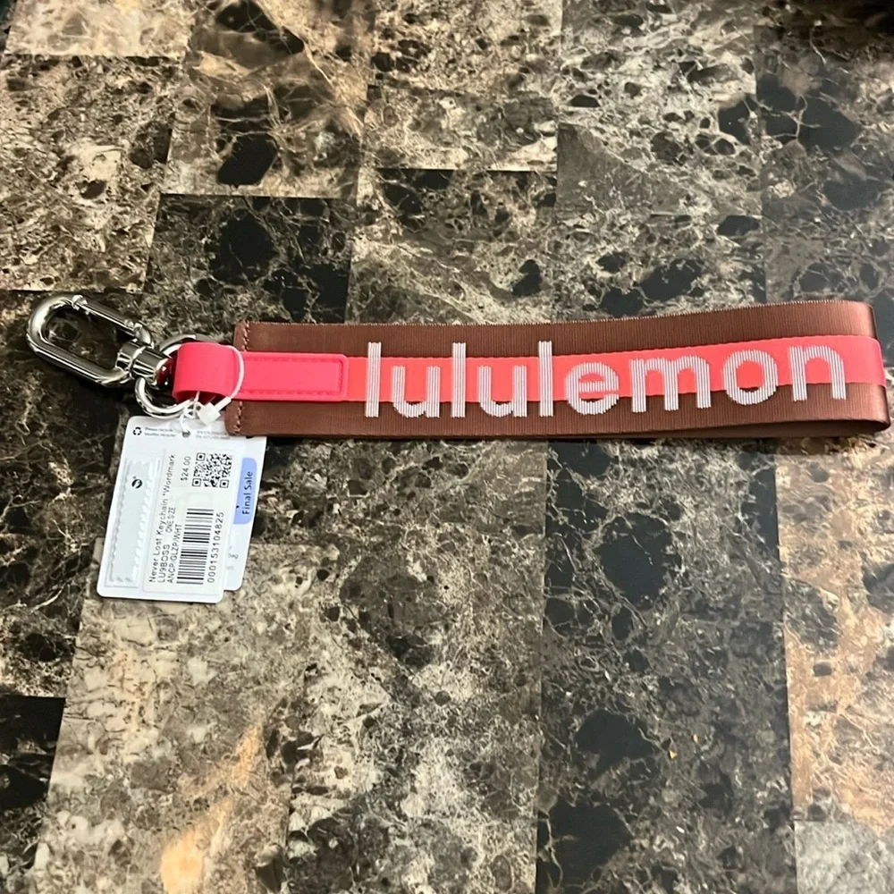LULULEMON NEVER LOST KEYCHAIN ORANGE AND BROWN COLOR NWT